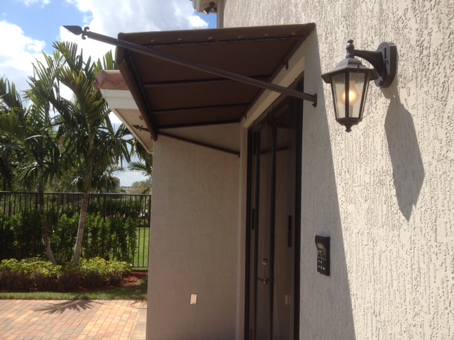 Decorative spear entry awning with lantern — South Florida